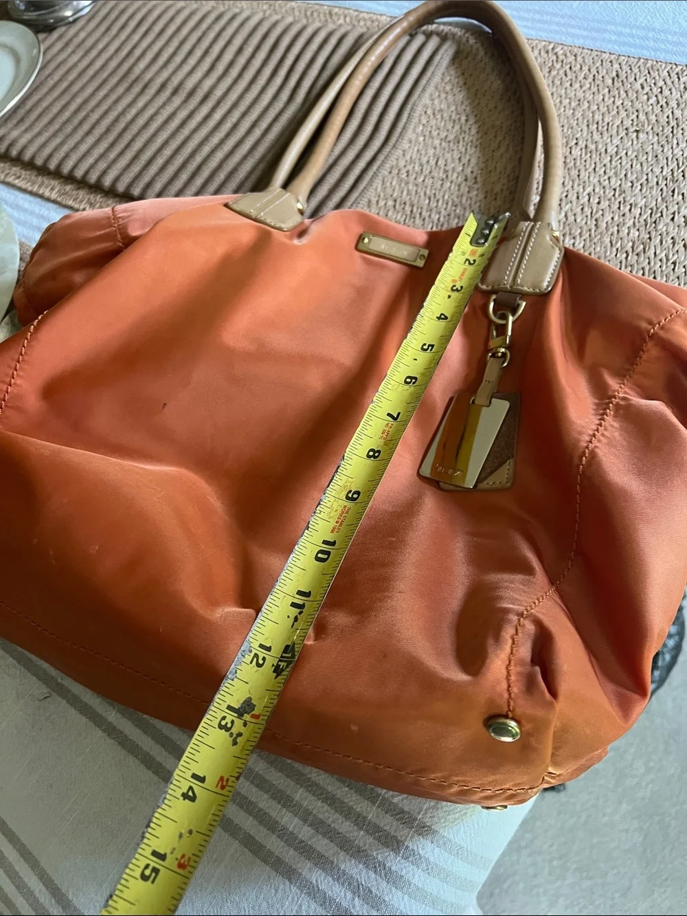 Tumi Orange Nylon Tote with Tan Leather Handles. Pre owned.